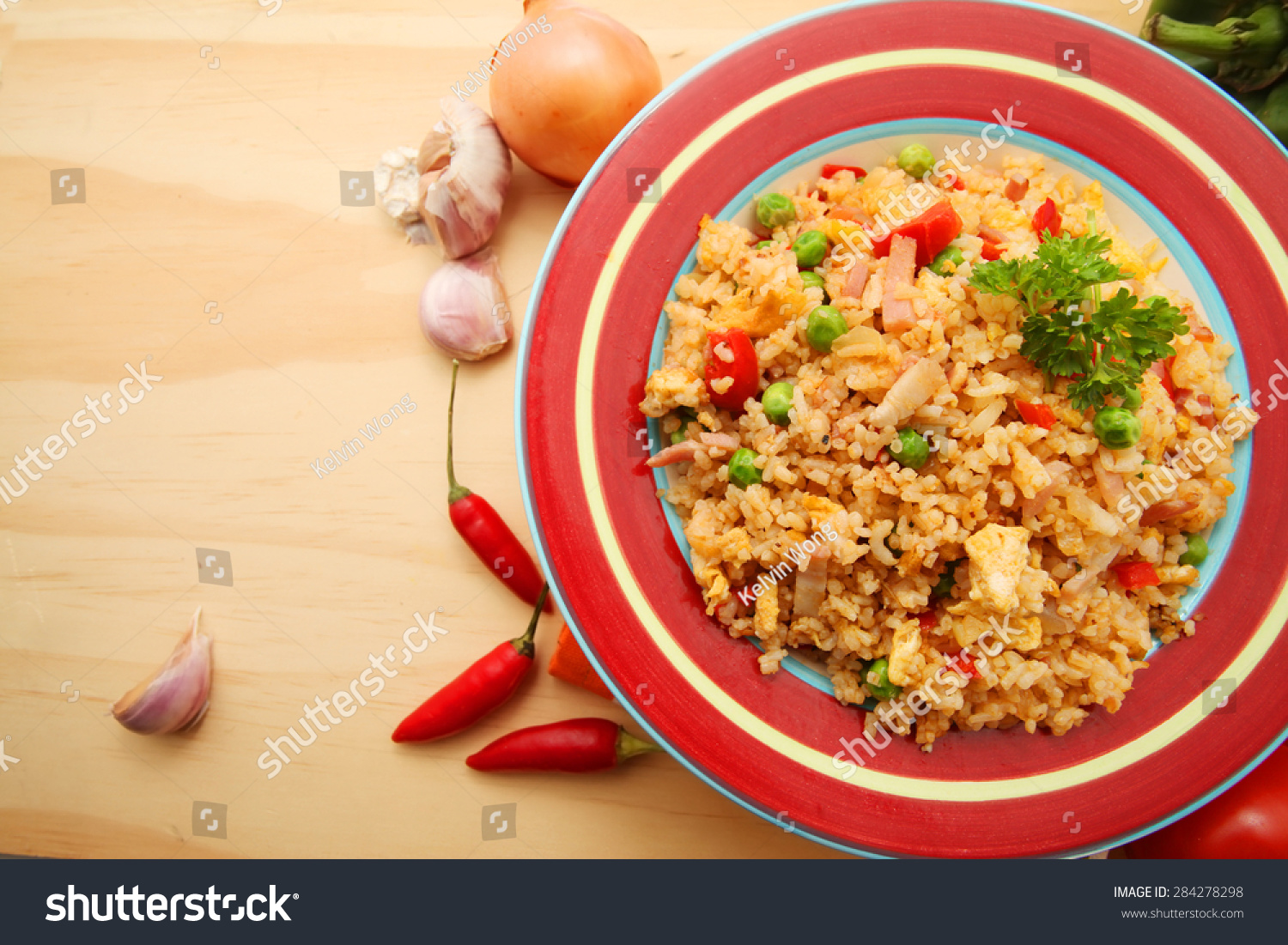 friedriceoverwoodentablebackgroundwithingredientswithcopyspace
